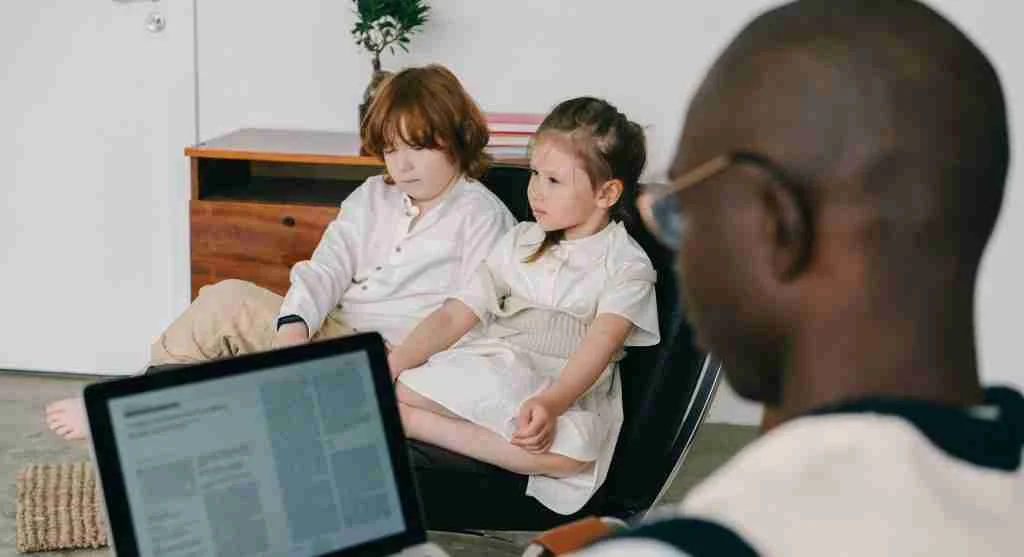 Child listening to friends discuss online content without understanding the reference