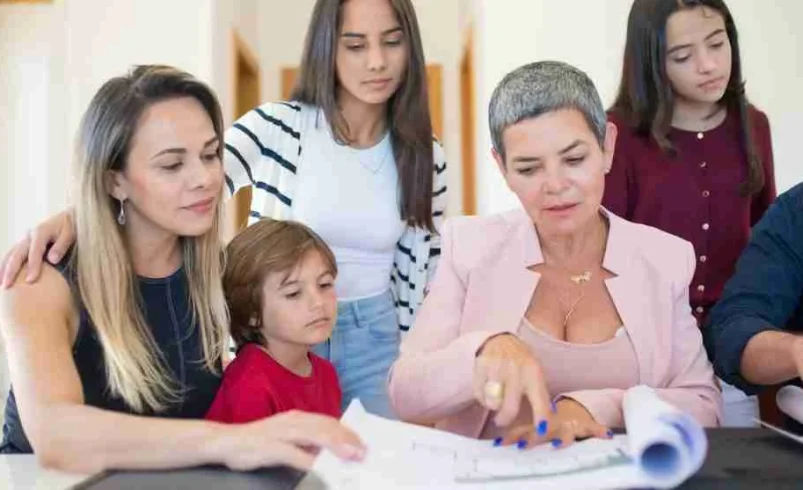 Caregivers using a family handoff routine to review schedules and responsibilities