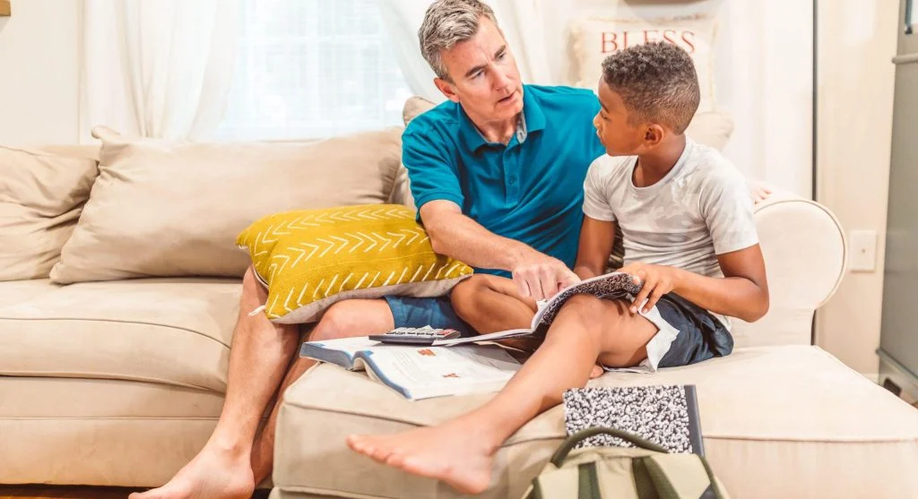 Parent and child discussing the meaning of a family rule