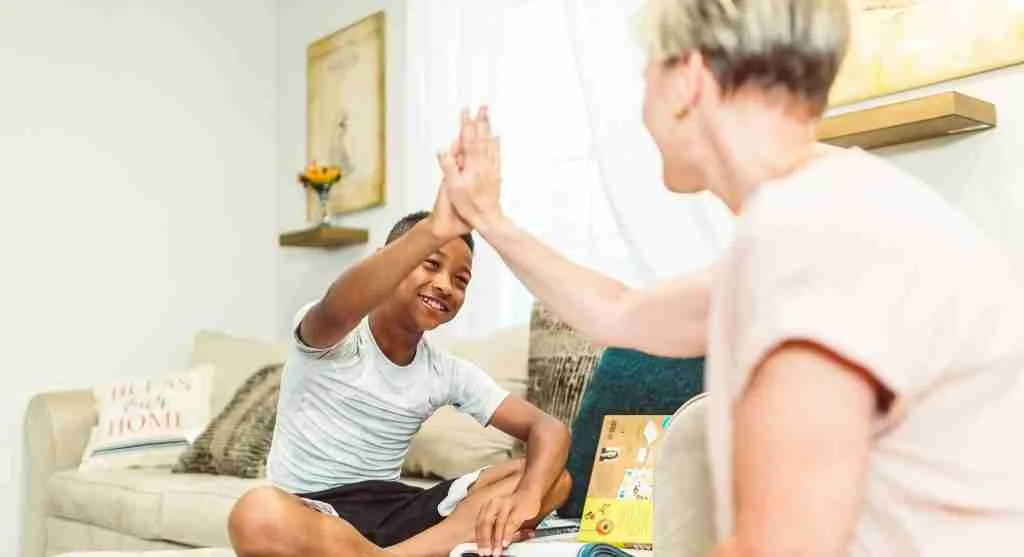 Parent offering thoughtful encouragement after a child completes a difficult task