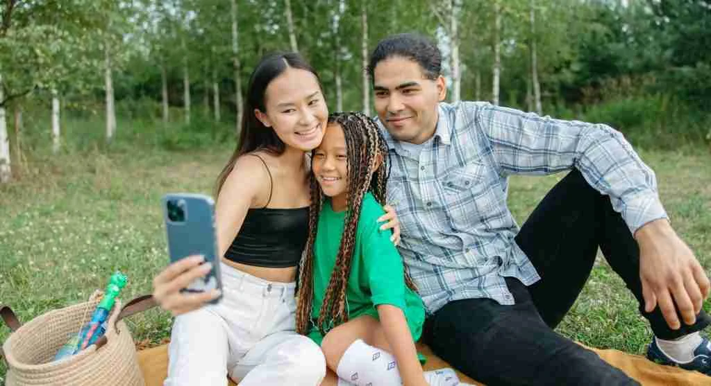 Family taking a planned rest break during an outing