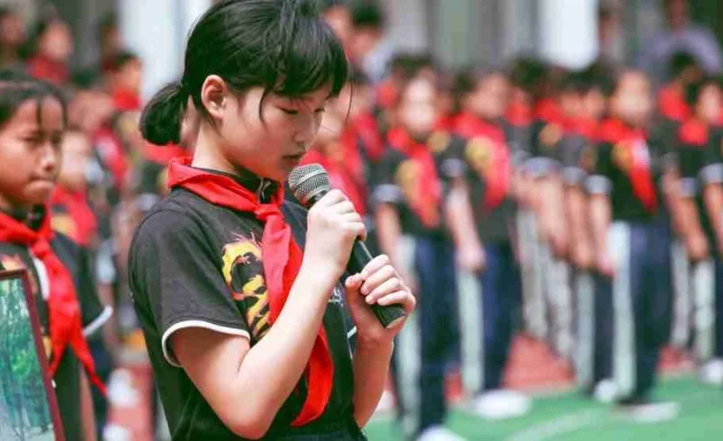 Child practicing a class presentation calmly at home